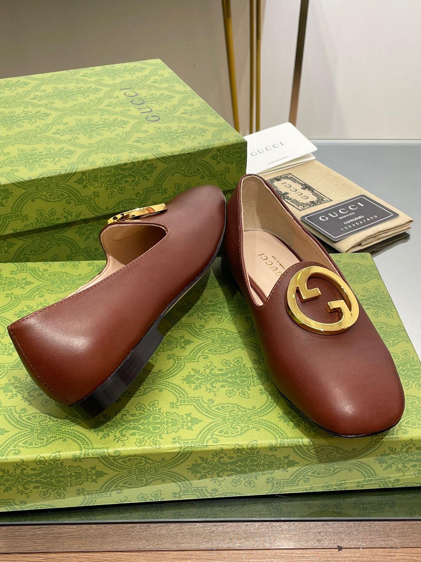 GUCCI BLONDIE LOGO-PLAQUE LOAFERS IN SYRUP BROWN CALFSKIN WITH GOLD HARDWARE