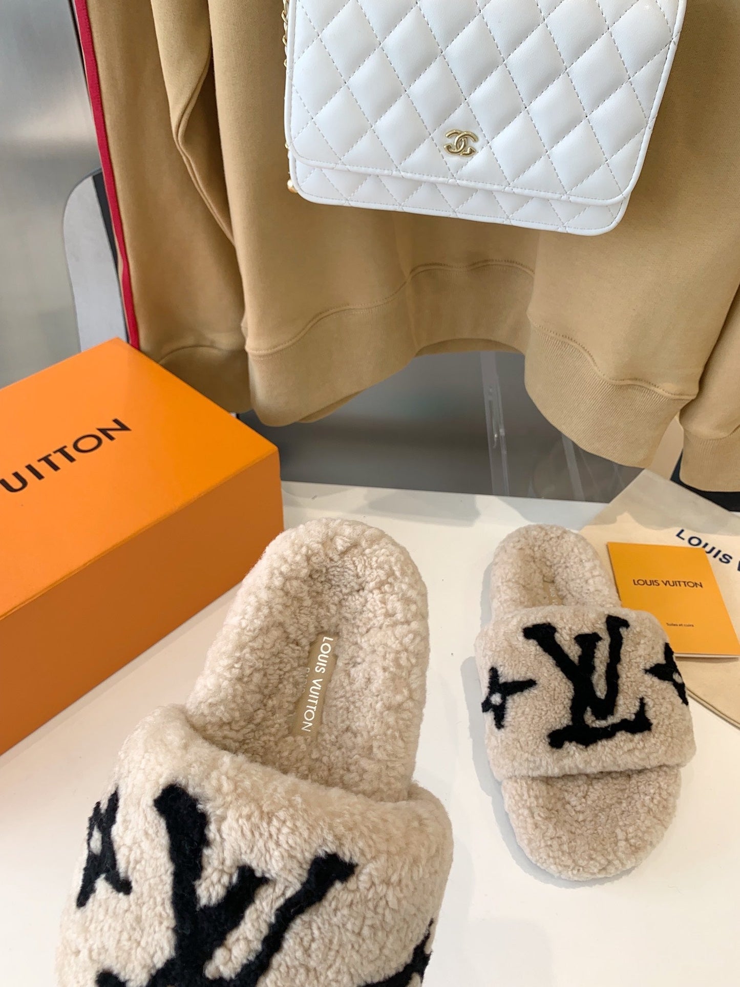 LOUIS VUITTON LV WOMEN'S PASEO FLAT SLIPPER IN TAN BROWN FLEECE WITH BLACK LOGO