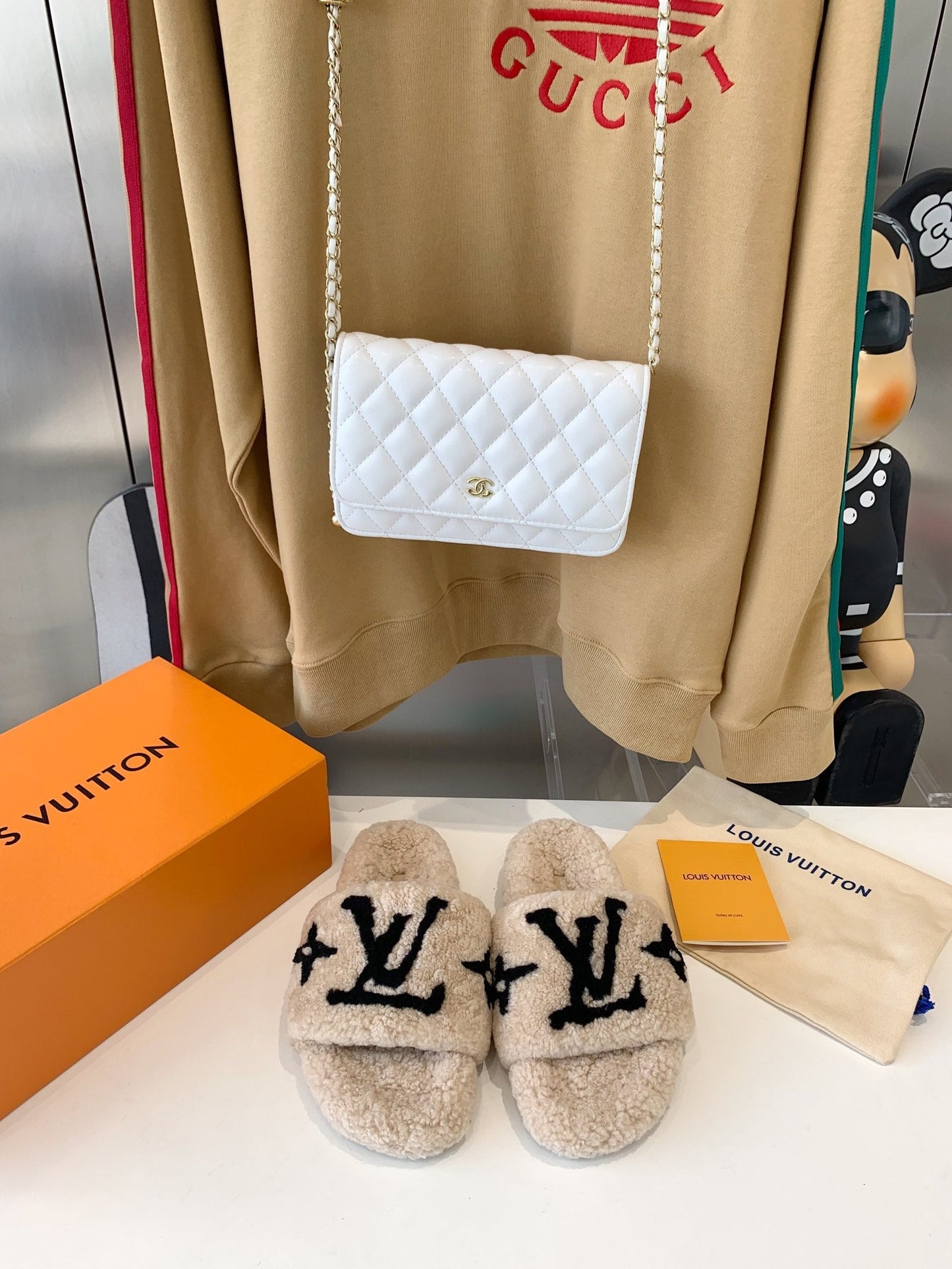 LOUIS VUITTON LV WOMEN'S PASEO FLAT SLIPPER IN TAN BROWN FLEECE WITH BLACK LOGO