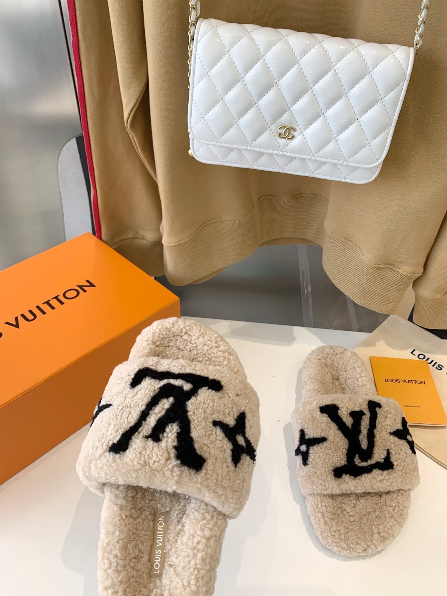 LOUIS VUITTON LV WOMEN'S PASEO FLAT SLIPPER IN TAN BROWN FLEECE WITH BLACK LOGO