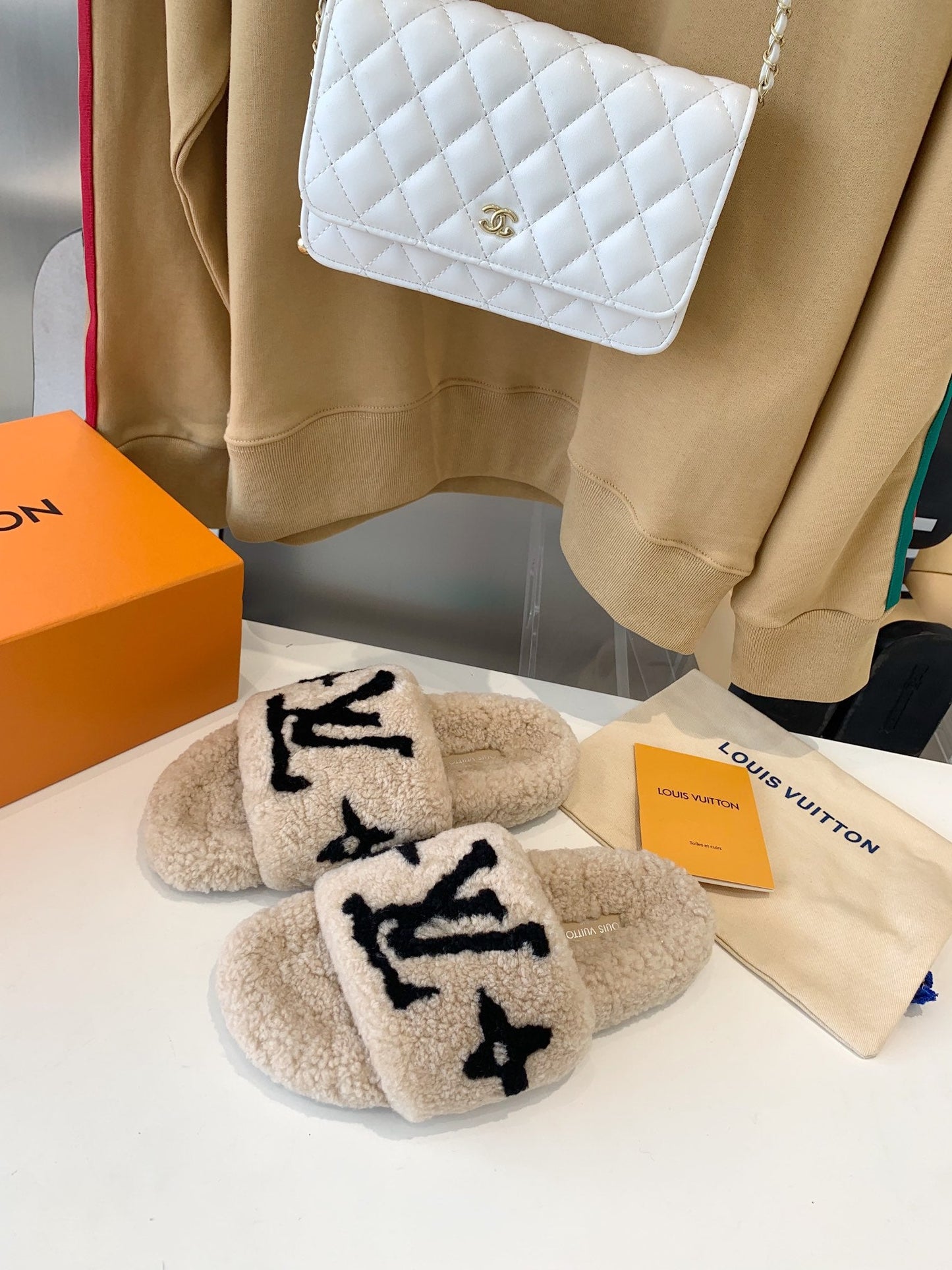 LOUIS VUITTON LV WOMEN'S PASEO FLAT SLIPPER IN TAN BROWN FLEECE WITH BLACK LOGO