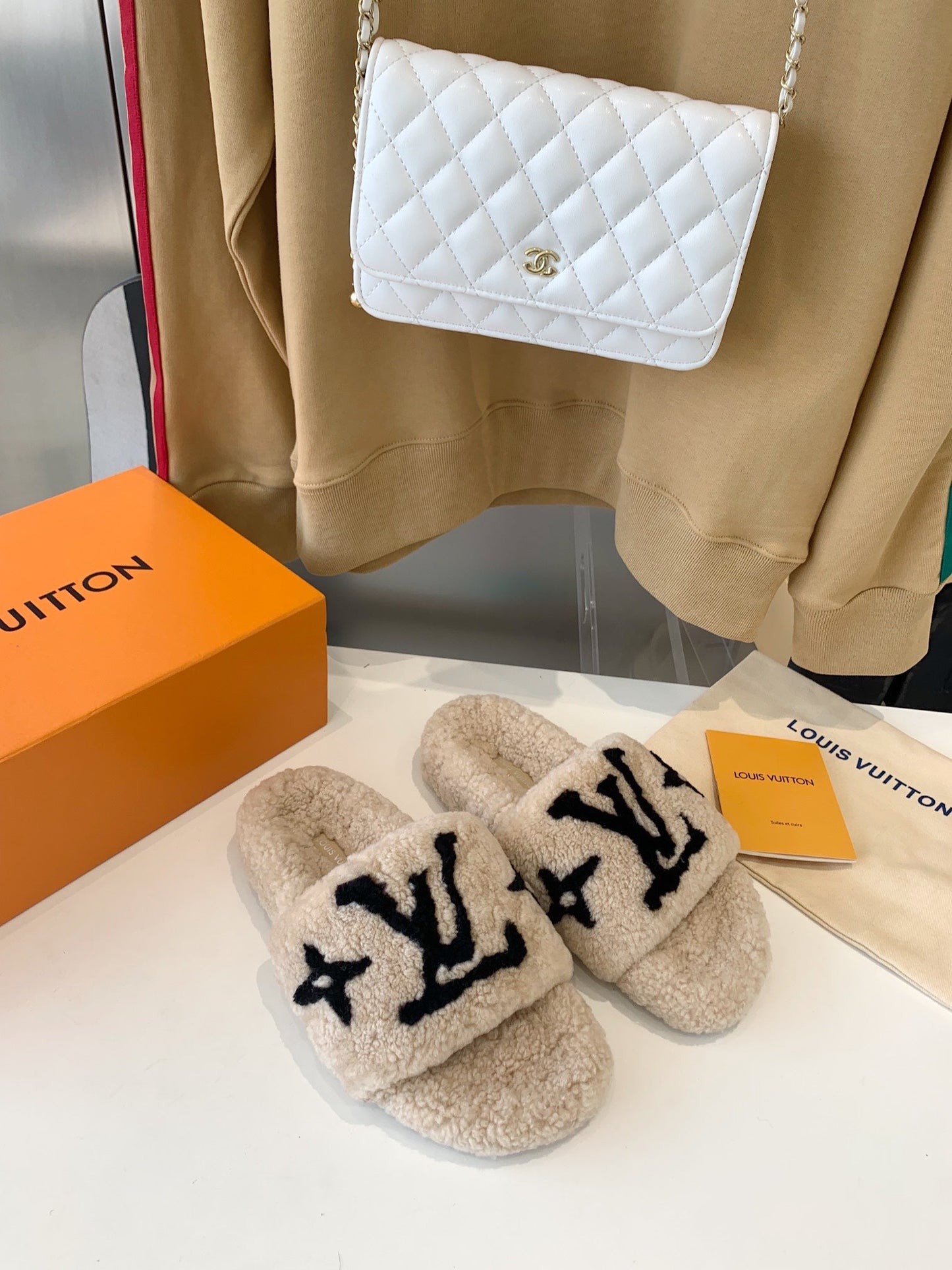 LOUIS VUITTON LV WOMEN'S PASEO FLAT SLIPPER IN TAN BROWN FLEECE WITH BLACK LOGO