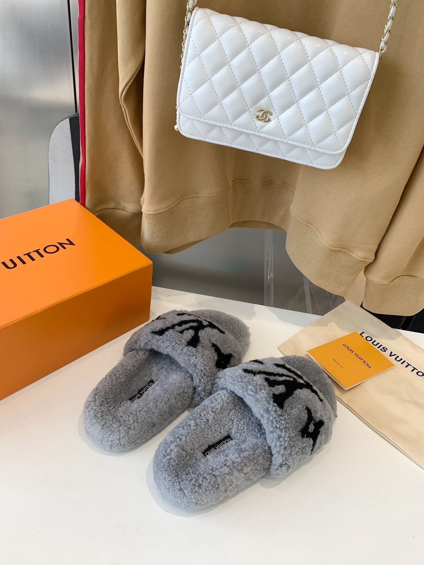 LOUIS VUITTON LV WOMEN'S PASEO FLAT SLIPPER IN GREY FLEECE WITH BLACK LOGO