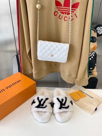 LOUIS VUITTON LV WOMEN'S PASEO FLAT SLIPPER IN WHITE FLEECE WITH BLACK LOGO