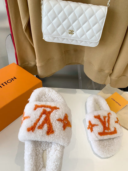LOUIS VUITTON LV WOMEN'S PASEO FLAT SLIPPER IN WHITE FLEECE WITH ORANGE LOGO