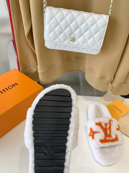 LOUIS VUITTON LV WOMEN'S PASEO FLAT SLIPPER IN WHITE FLEECE WITH ORANGE LOGO
