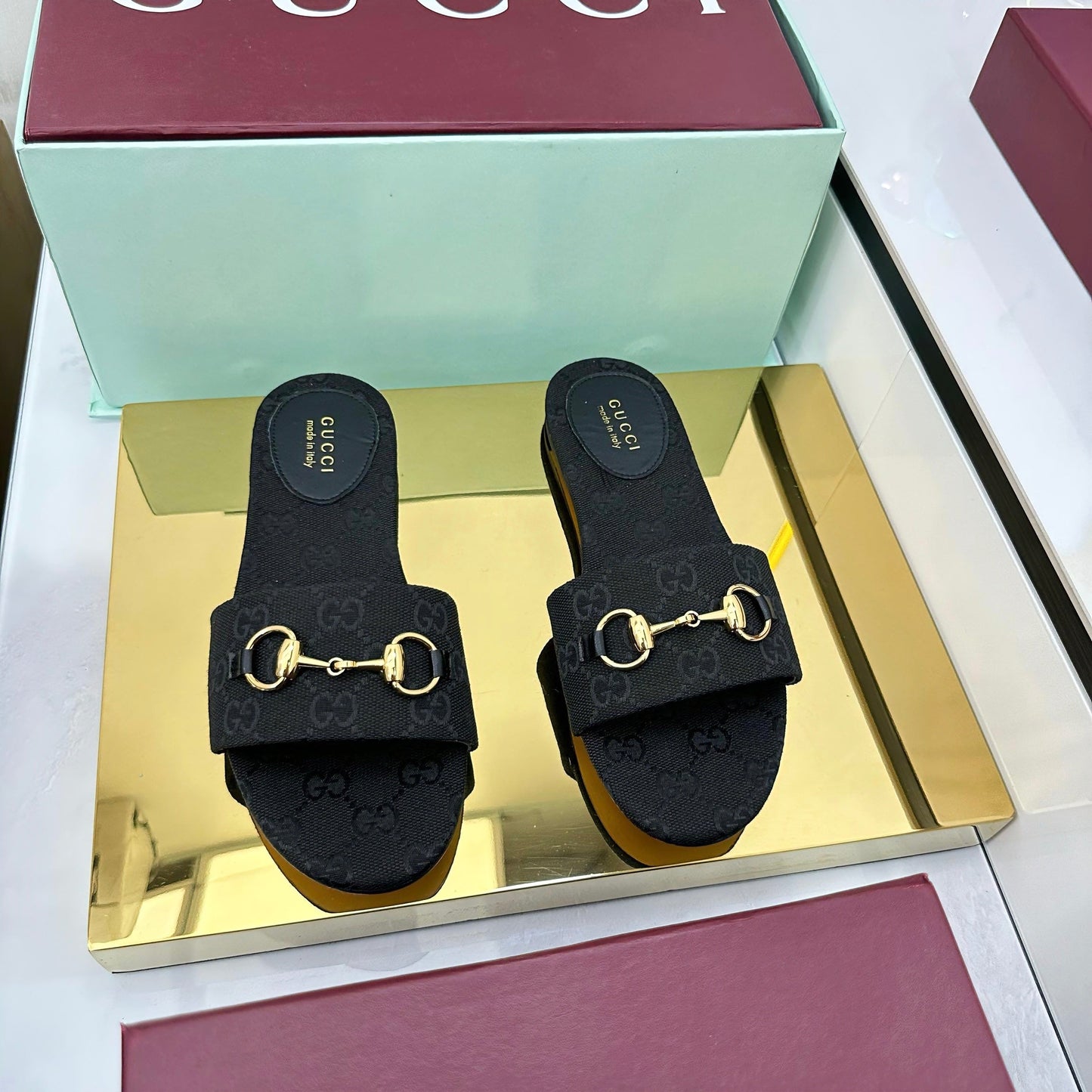 GUCCI SLIDES IN BLACK WITH GOLD HARDWARE
