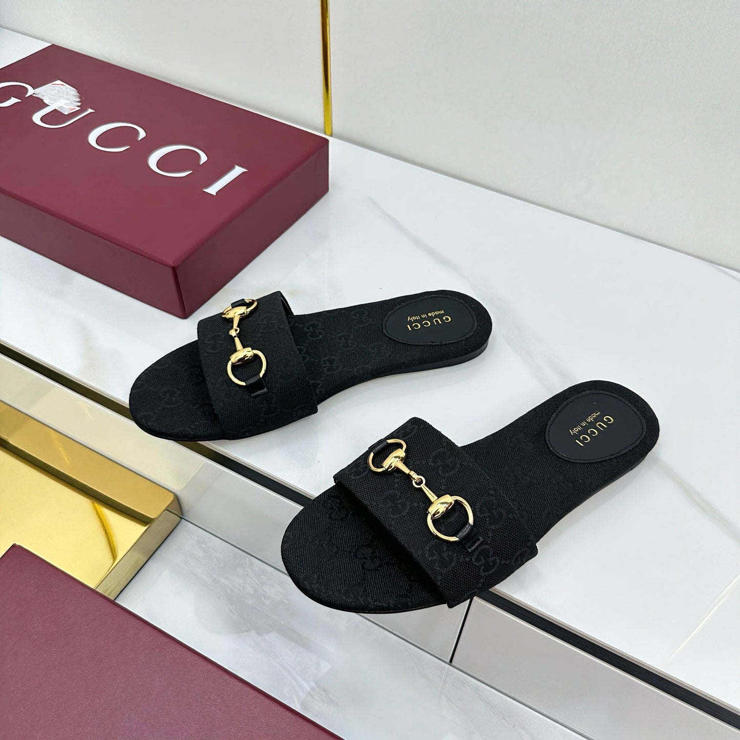 GUCCI SLIDES IN BLACK WITH GOLD HARDWARE