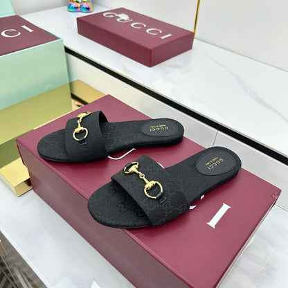 GUCCI SLIDES IN BLACK WITH GOLD HARDWARE