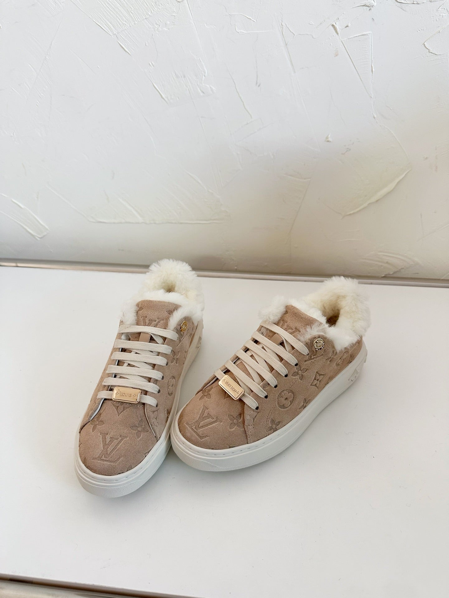 LOUIS VUITTON TIME OUT SNEAKER IN DESERT BROWN MONOGRAM EMBOSSED SUEDE WITH FLEECE LINING