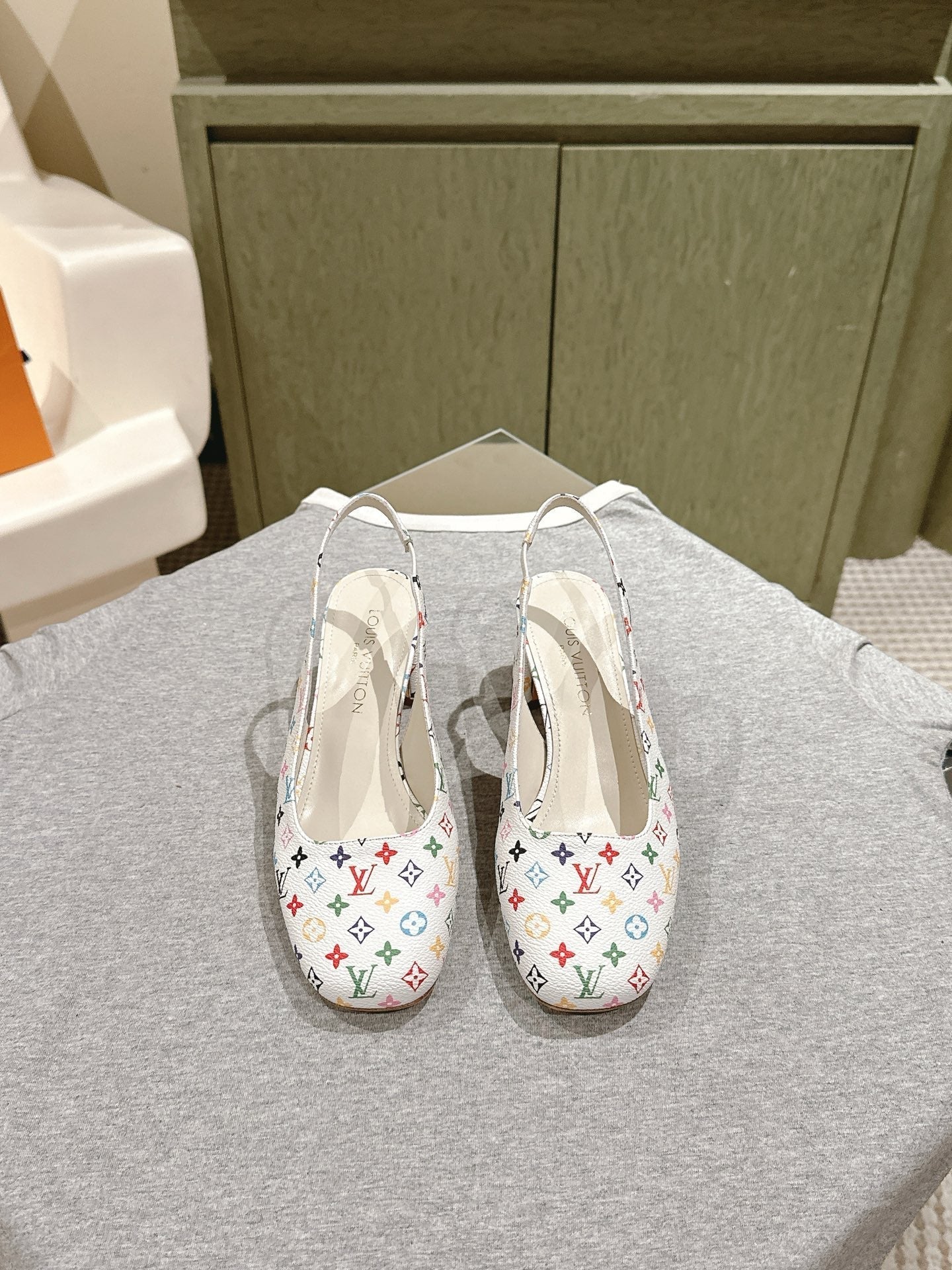 LOUIS VUITTON SWING SLINGBACK PUMP 55 MM IN WHITE MONOGRAM CALFSKIN