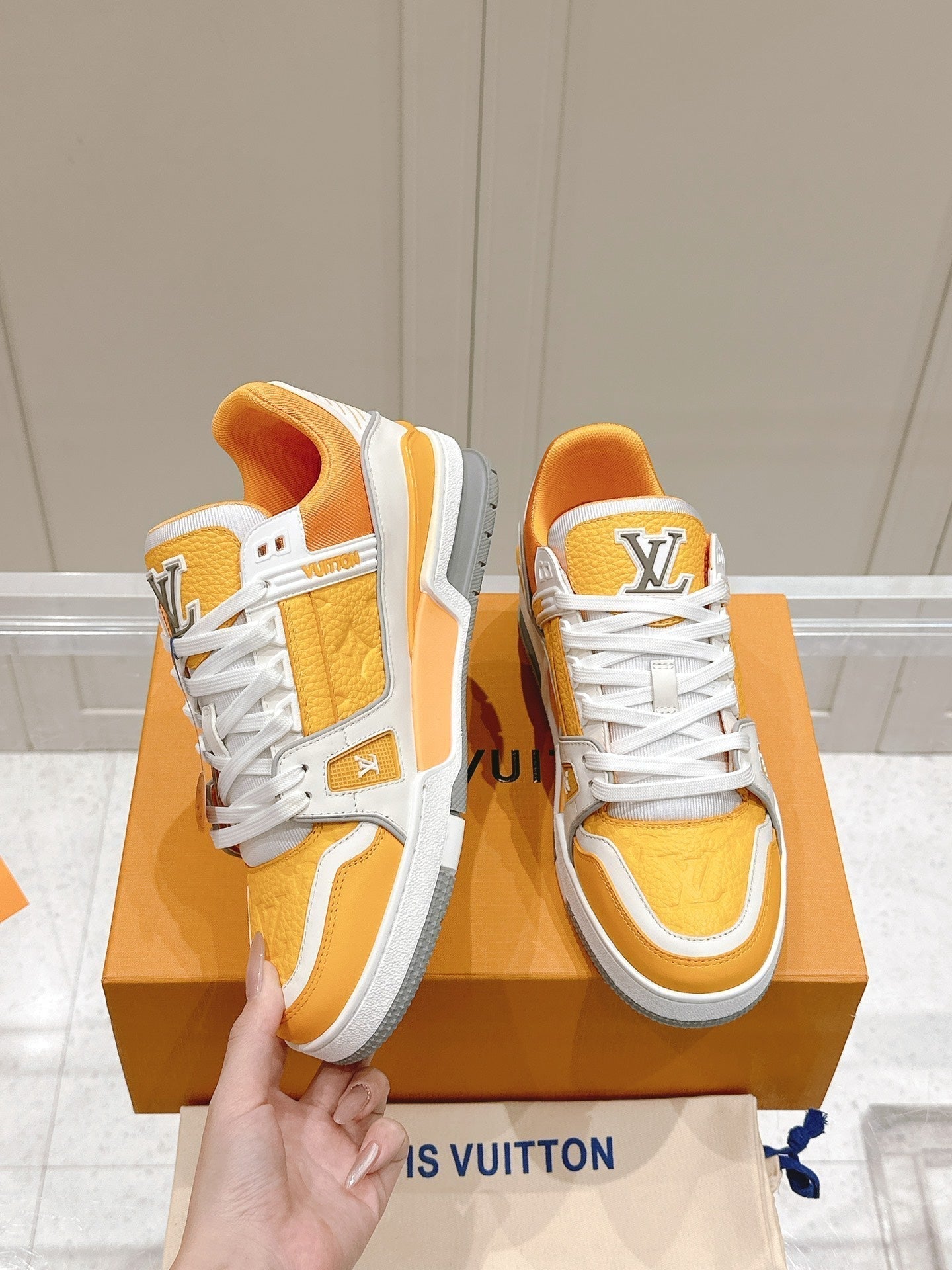 LOUIS VUITTON LV TRAINER SNEAKER IN SAFFRAN YELLOW GRAINED CALFSKIN