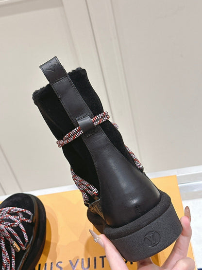 LOUIS VUITTON ASPEN PLATFORM ANKLE BOOT IN BLACK MONOGRAM DEBOSSED SUEDE AND SHEARLING