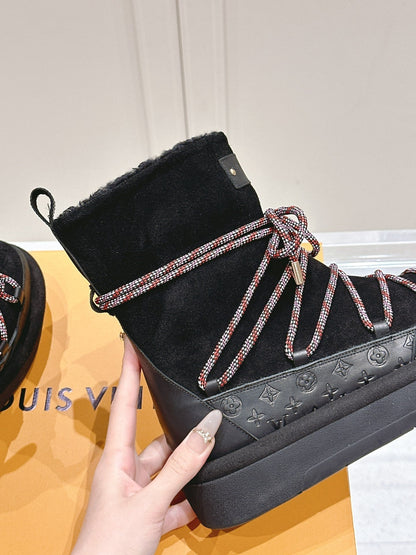 LOUIS VUITTON ASPEN PLATFORM ANKLE BOOT IN BLACK MONOGRAM DEBOSSED SUEDE AND SHEARLING