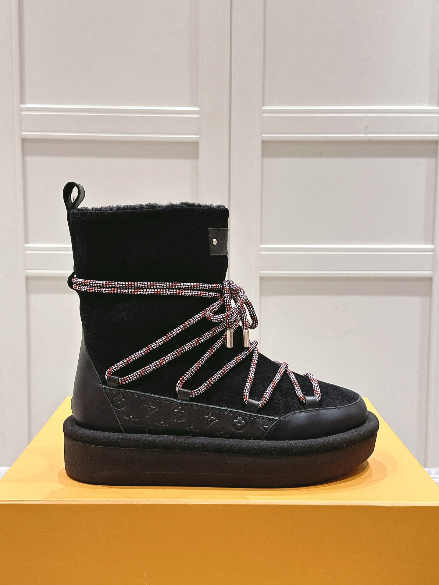 LOUIS VUITTON ASPEN PLATFORM ANKLE BOOT IN BLACK MONOGRAM DEBOSSED SUEDE AND SHEARLING
