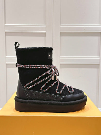 LOUIS VUITTON ASPEN PLATFORM ANKLE BOOT IN BLACK MONOGRAM DEBOSSED SUEDE AND SHEARLING