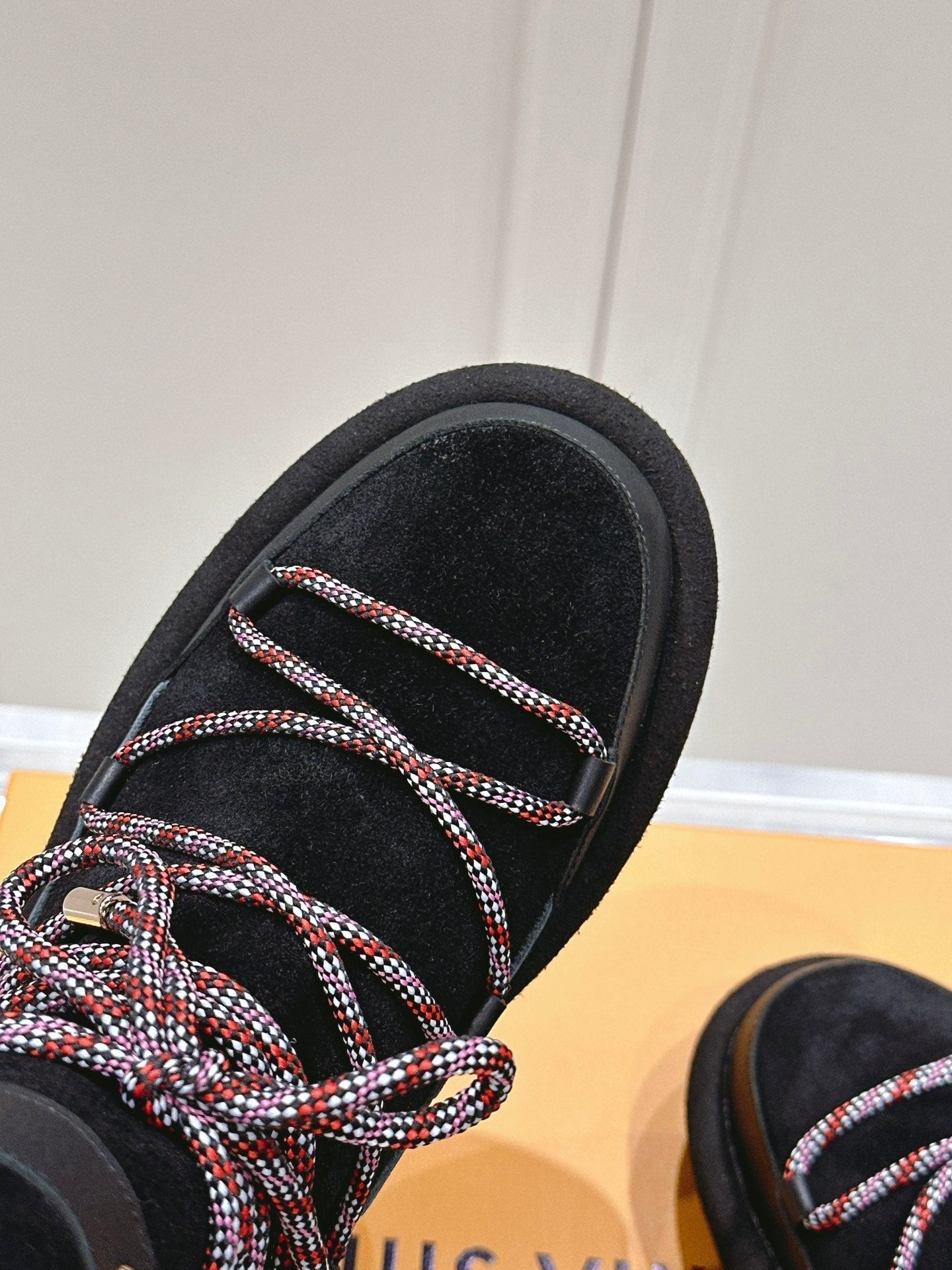 LOUIS VUITTON ASPEN PLATFORM ANKLE BOOT IN BLACK MONOGRAM DEBOSSED SUEDE AND SHEARLING