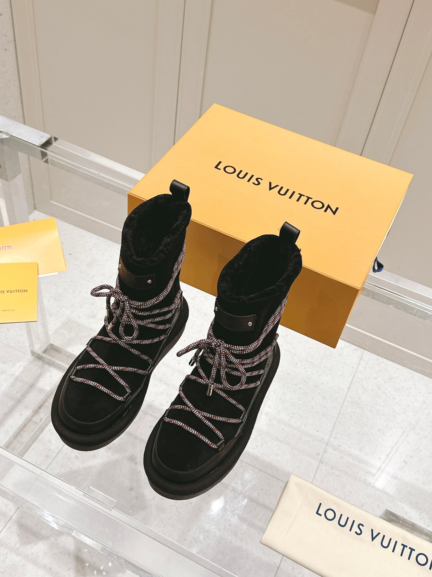LOUIS VUITTON ASPEN PLATFORM ANKLE BOOT IN BLACK MONOGRAM DEBOSSED SUEDE AND SHEARLING