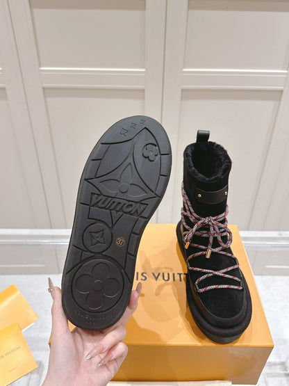 LOUIS VUITTON ASPEN PLATFORM ANKLE BOOT IN BLACK MONOGRAM DEBOSSED SUEDE AND SHEARLING