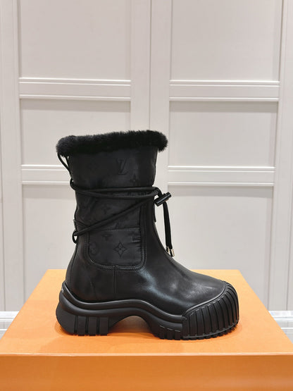 LOUIS VUITTON RUBY FLAT ANKLE BOOT IN BLACK CALFSKIN AND MONOGRAM NYLON