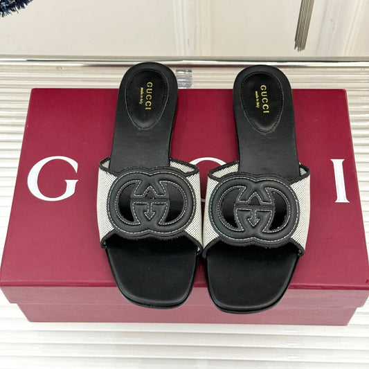 GUCCI SLIDE SANDALS IN BLACK AND WHITE CALFSKIN