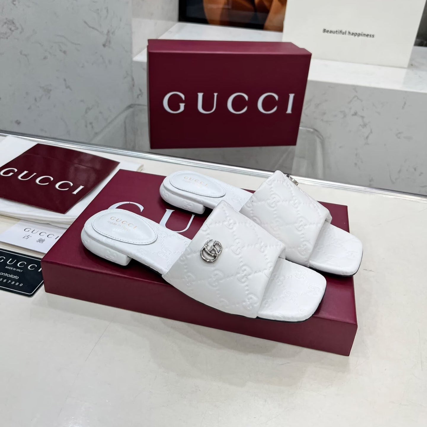 GUCCI CASUAL SLIPPERS IN WHITE CALFSKIN LOGO EMBOSSING