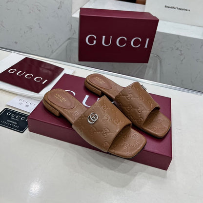GUCCI CASUAL SLIPPERS IN BROWN CALFSKIN LOGO EMBOSSING