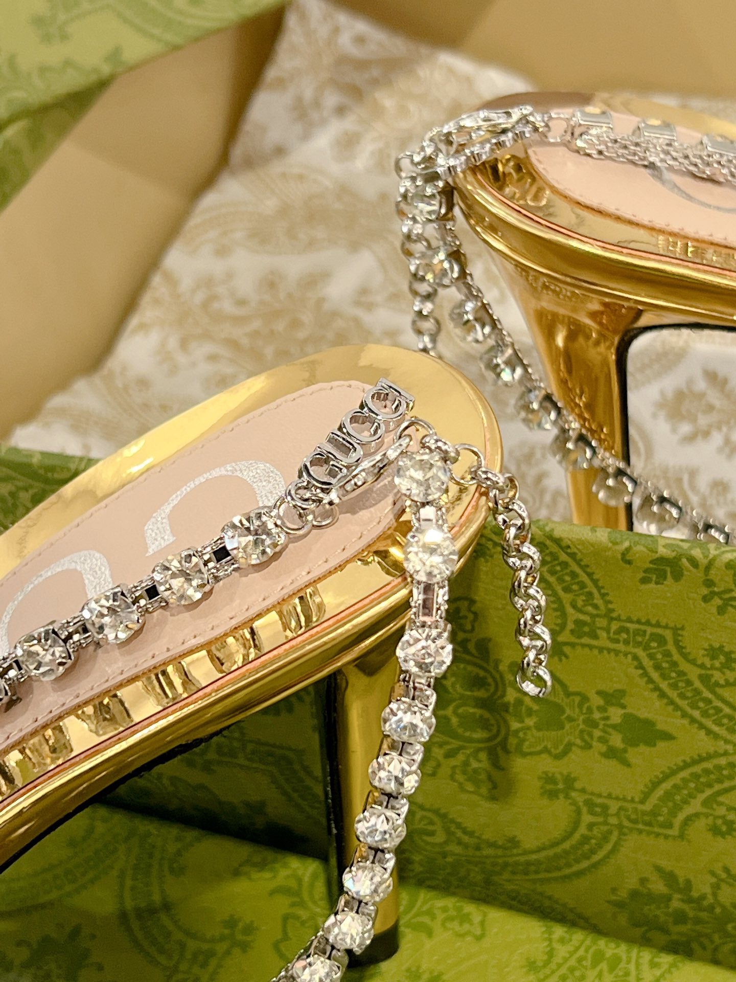 GUCCI STRAPPY SANDAL WITH RHINESTONE CHAIN IN GOLD PATENT LEATHER