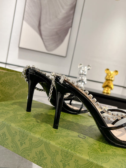GUCCI STRAPPY SANDAL WITH RHINESTONE CHAIN IN BLACK PATENT LEATHER