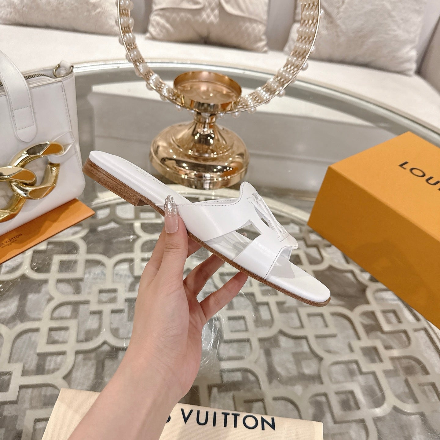 LOUIS VUITTON ISOLA FLAT SLIDE IN WHITE CALFSKIN