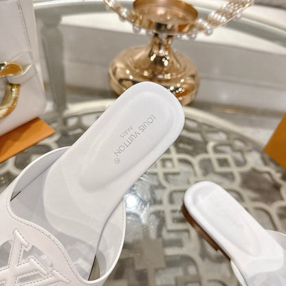 LOUIS VUITTON ISOLA FLAT SLIDE IN WHITE CALFSKIN