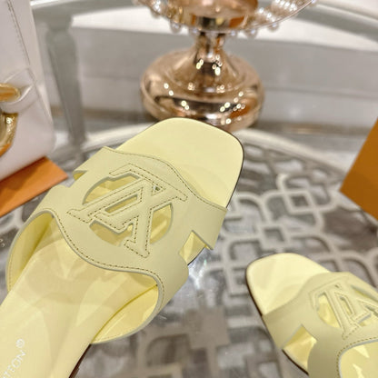 LOUIS VUITTON ISOLA FLAT SLIDE IN PALE YELLOW CALFSKIN