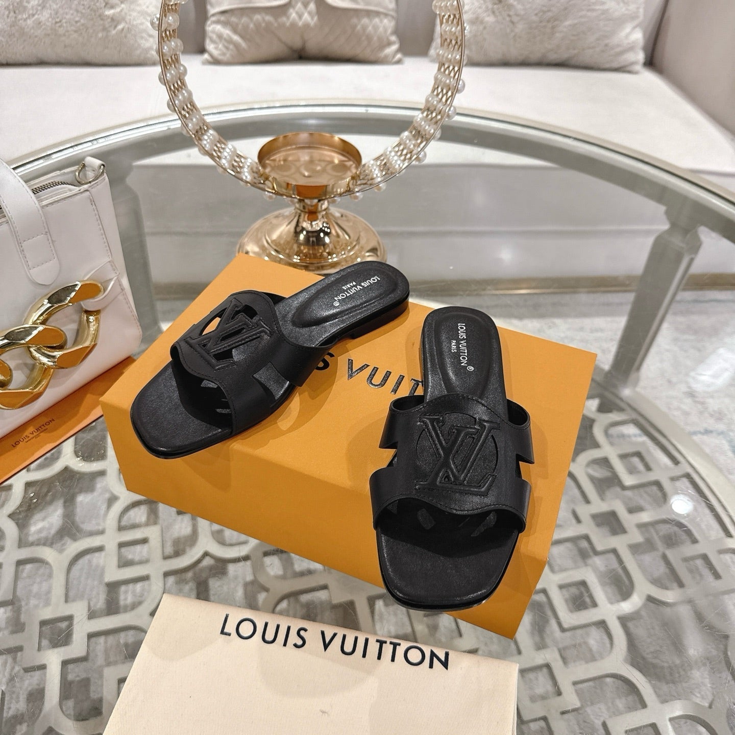 LOUIS VUITTON ISOLA FLAT SLIDE IN BLACK CALFSKIN