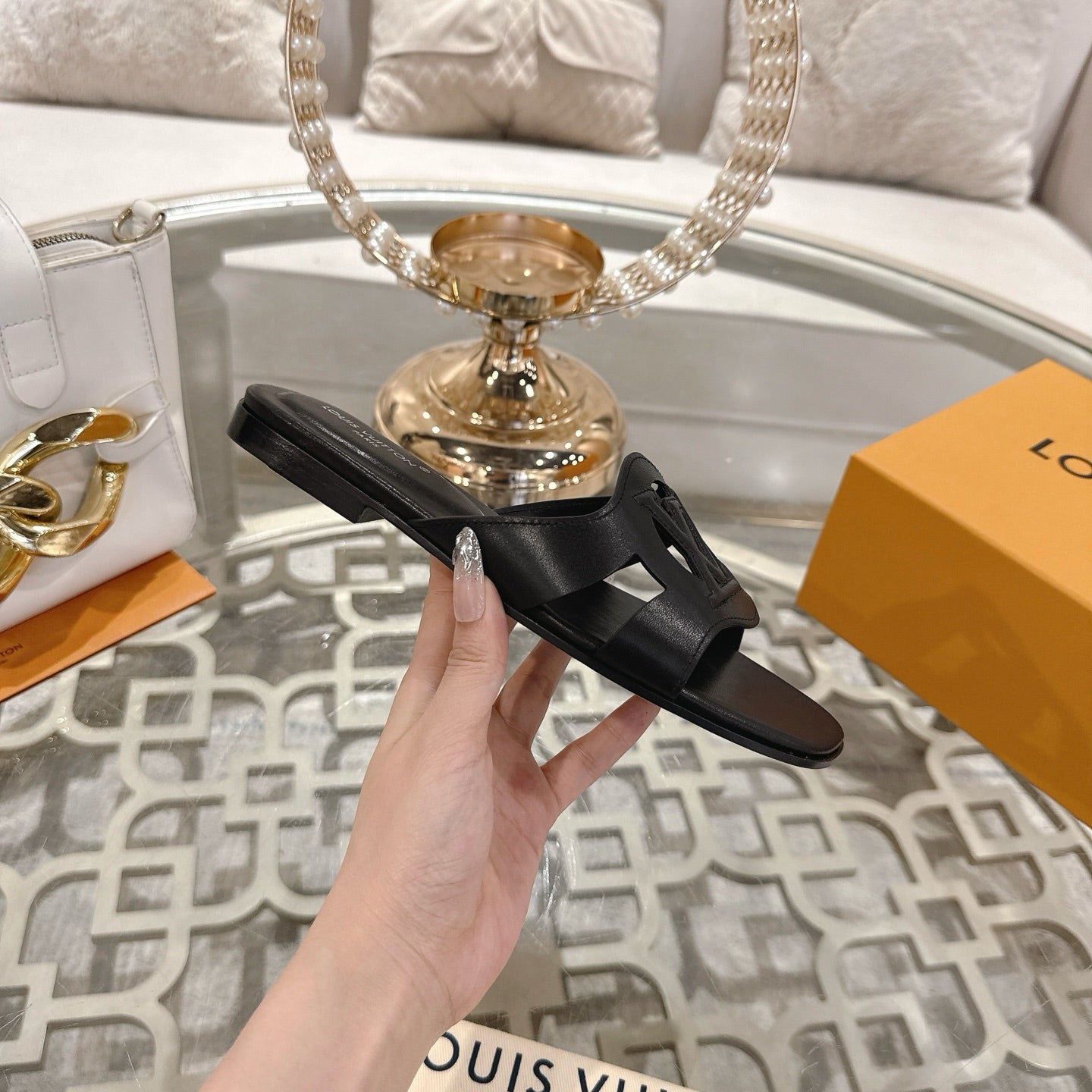 LOUIS VUITTON ISOLA FLAT SLIDE IN BLACK CALFSKIN