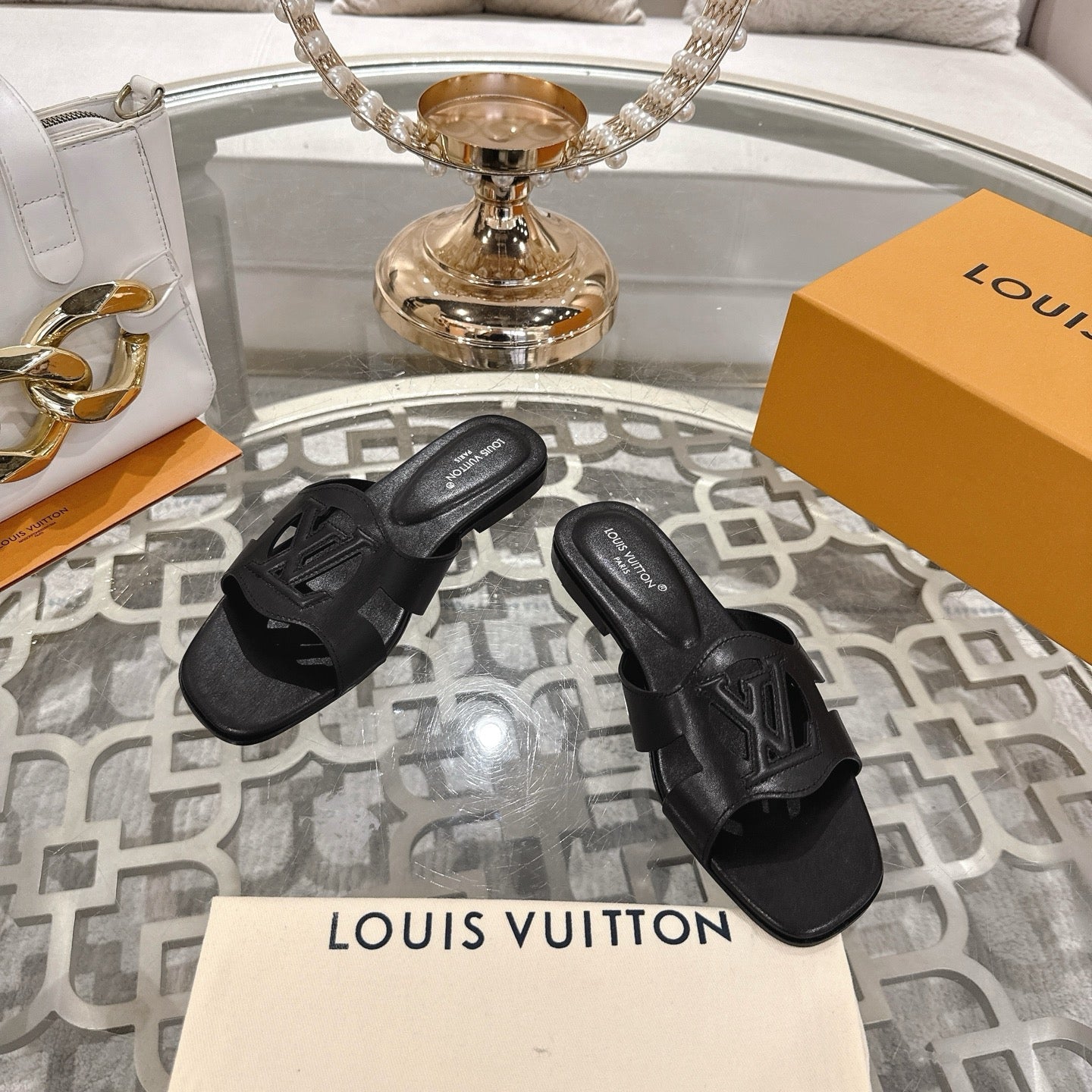 LOUIS VUITTON ISOLA FLAT SLIDE IN BLACK CALFSKIN