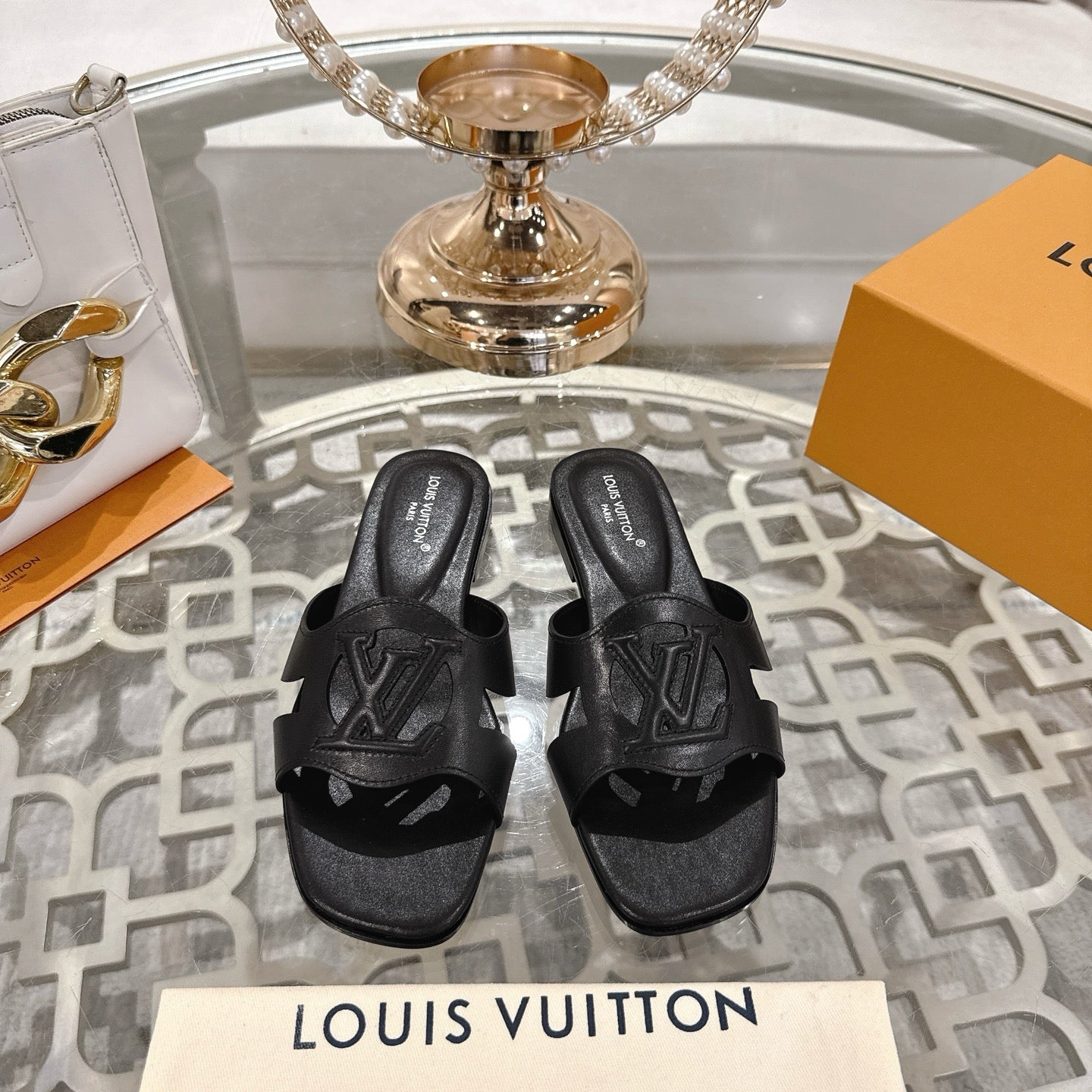 LOUIS VUITTON ISOLA FLAT SLIDE IN BLACK CALFSKIN