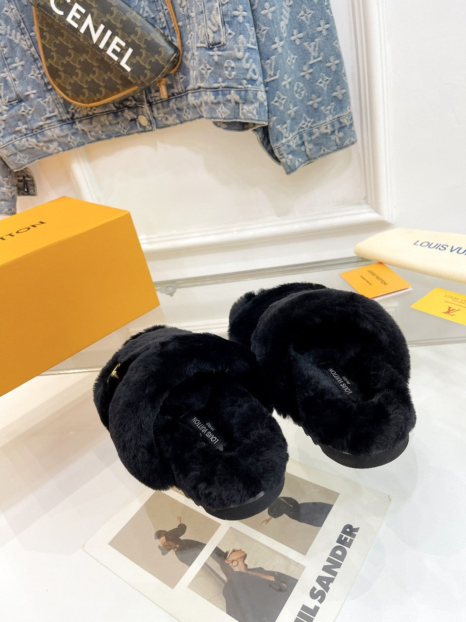 LOUIS VUITTON HALF MULE SLIPPERS IN BLACK FLEECE FEATURING METALLIC LOGO
