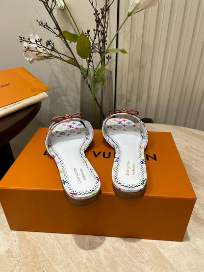 LOUIS VUITTON FLAT MULES IN WHITE MONOGRAM LAMBSKIN