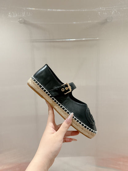 GUCCI CROSS STRAP FLAT SHOES IN BLACK CALFSKIN WITH STRAW SOLE