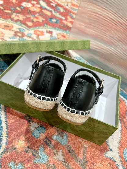 GUCCI CROSS STRAP FLAT SHOES IN BLACK CALFSKIN WITH STRAW SOLE