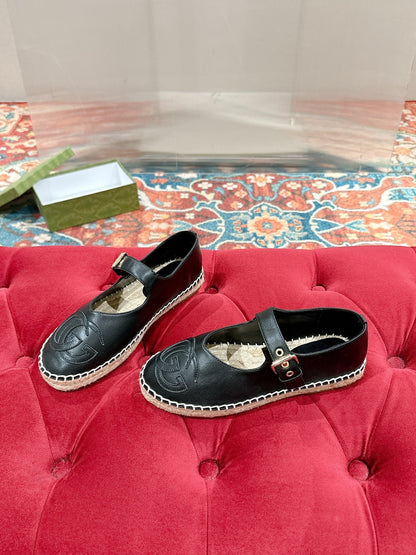 GUCCI CROSS STRAP FLAT SHOES IN BLACK CALFSKIN WITH STRAW SOLE