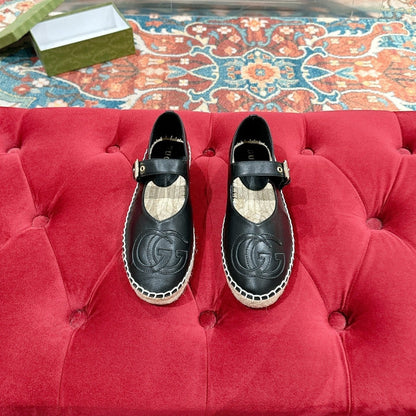 GUCCI CROSS STRAP FLAT SHOES IN BLACK CALFSKIN WITH STRAW SOLE