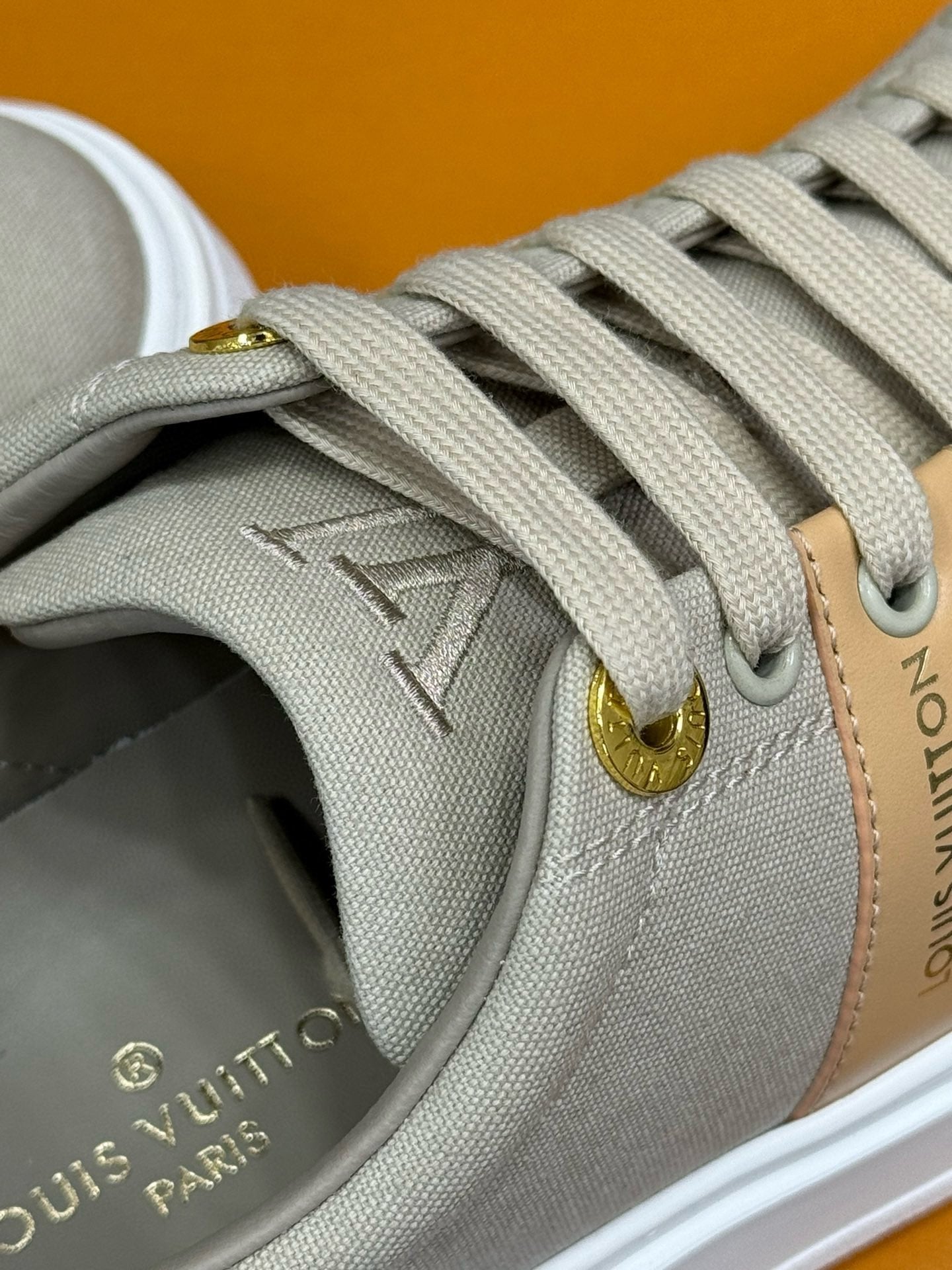 LOUIS VUITTON LV TIME OUT SNEAKER IN PASTEL GRAY MIX MACAROON GOLD CANVAS