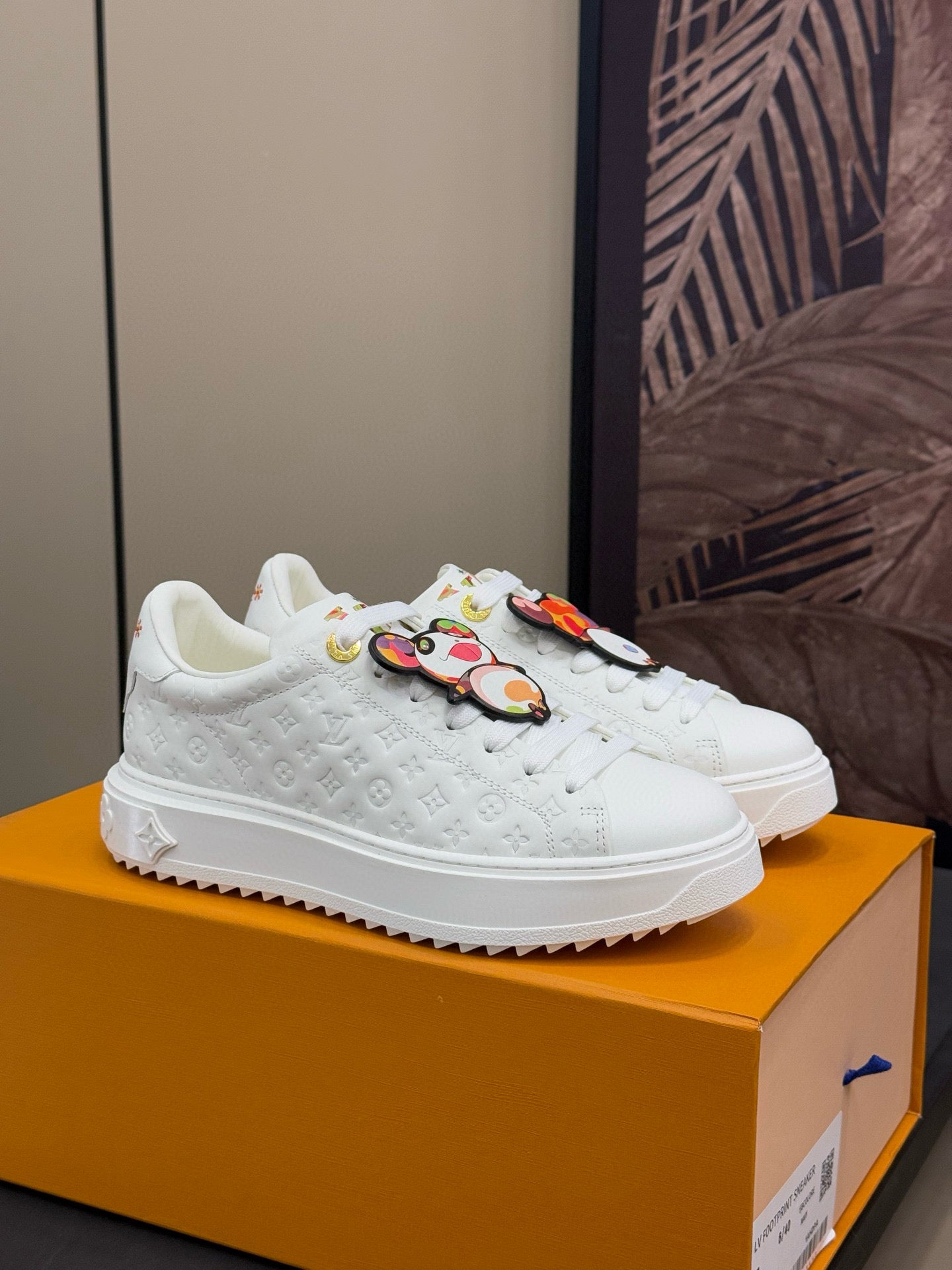 LOUIS VUITTON TIME OUT SNEAKER IN WHITE EMBOSSED MONOGRAM CALFSKIN