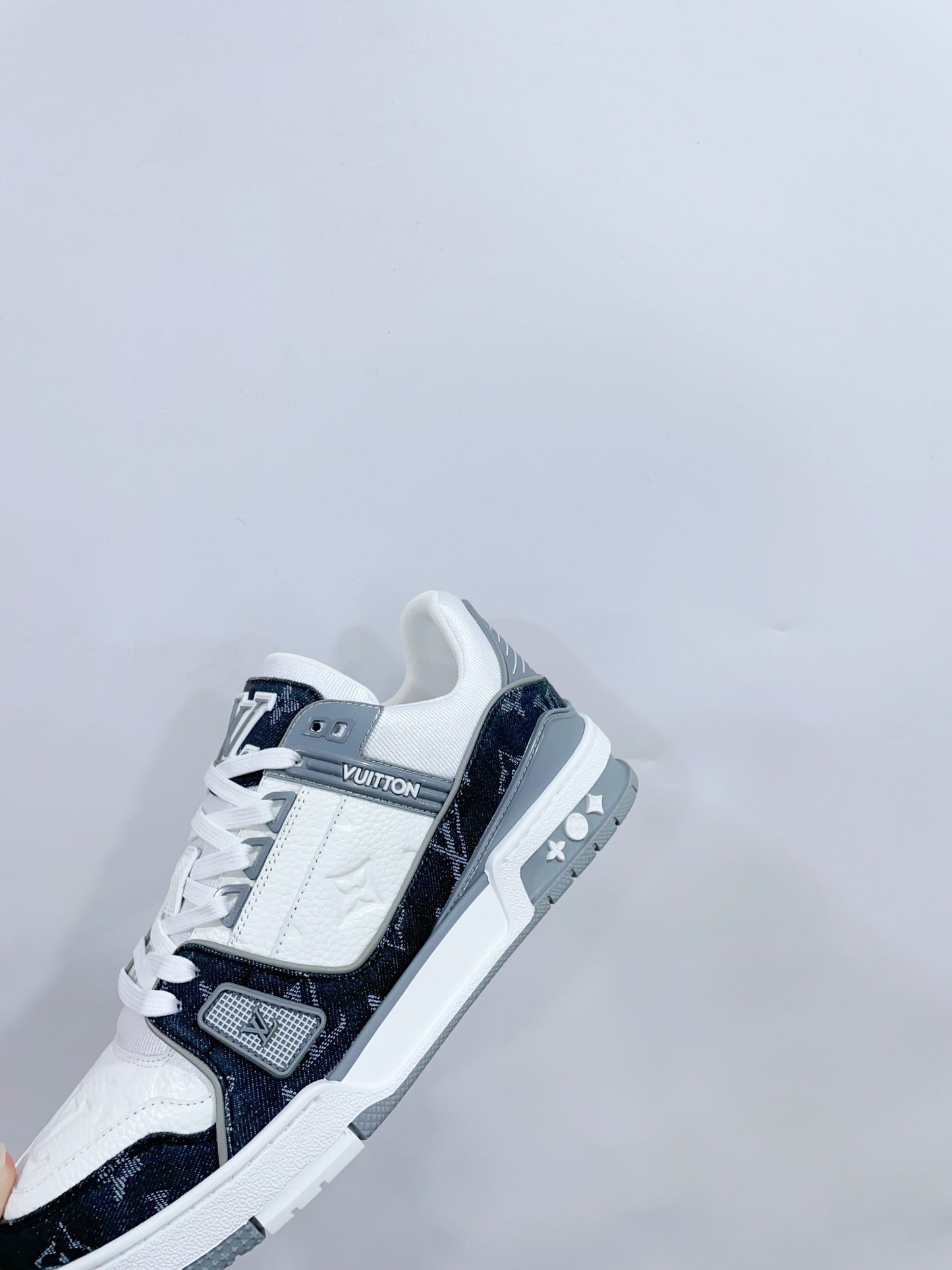 LOUIS VUITTON LV TRAINER SNEAKER IN WHITE CALFSKIN AND BLACK MONOGRAM DENIM