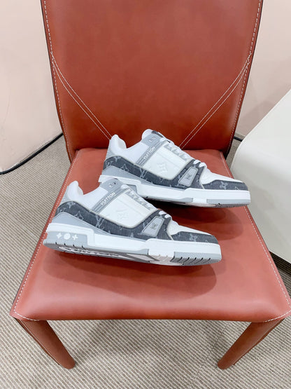 LOUIS VUITTON LV TRAINER SNEAKER IN WHITE CALFSKIN AND BLACK MONOGRAM DENIM